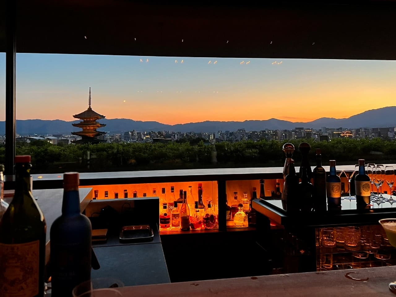 Breathtaking dusk view over Kyoto from Bar KOHAKU, with vibrant evening colors