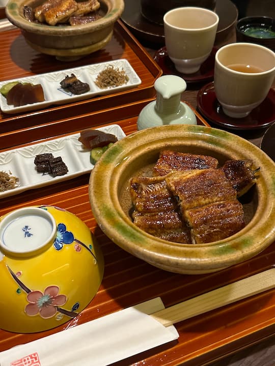 Three small side dishes served with the set meal at Okuniya Mambei, a Kyoto unagi restaurant